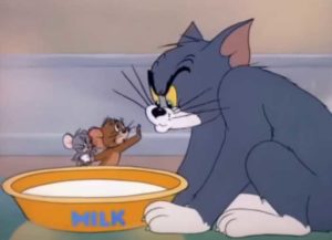 Jerry telling Tom to not drink from a bowl of milk